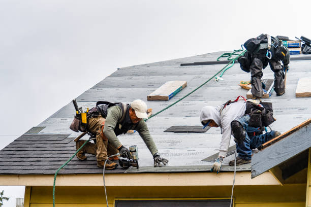 Professional Gutter Installation technician working in Bolton, MA